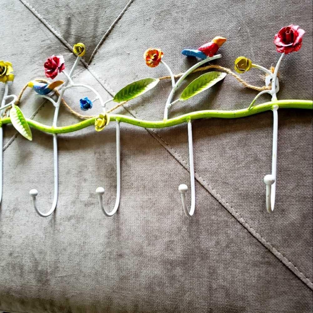 Decorative holder for child's clothes or other small belongings....made of metal